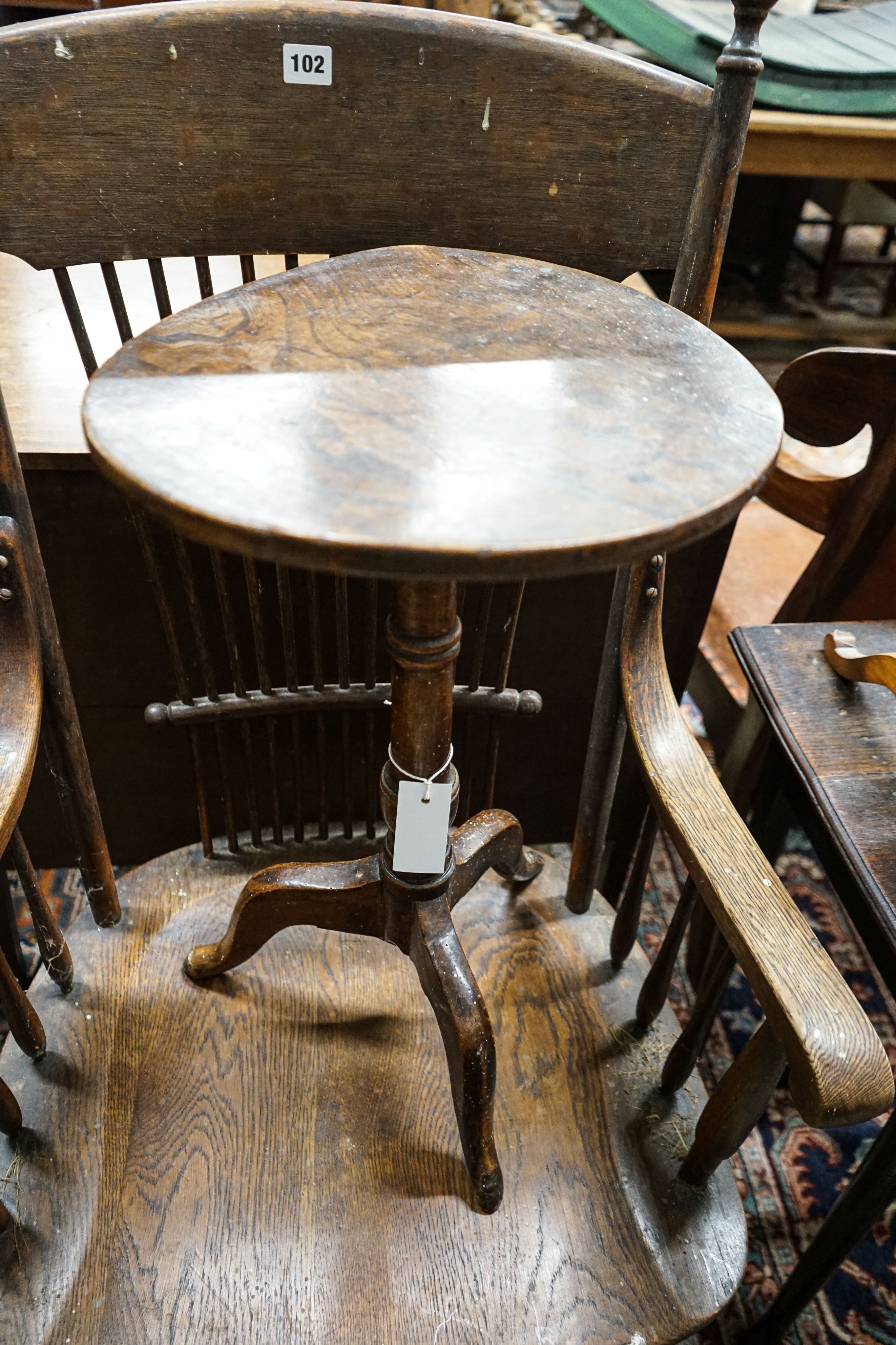 A mid 18th century elm tripod table, diameter 35cm (a.f.), height 57cm, a late Victorian oak stick back chair and two toilet mirrors